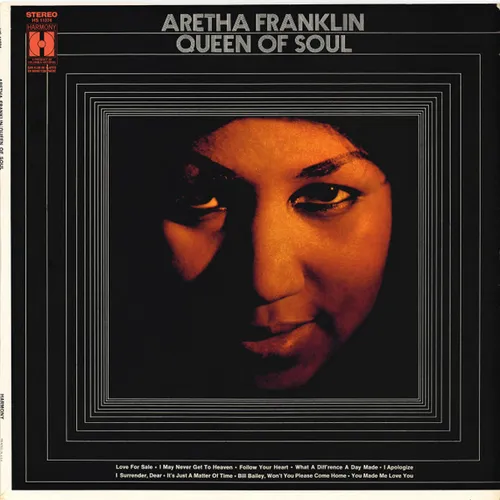 A close-cropped portrait of a woman's face lit in warm amber and orange tones against a black background, framed by concentric thin-line rectangles on a dark cover.