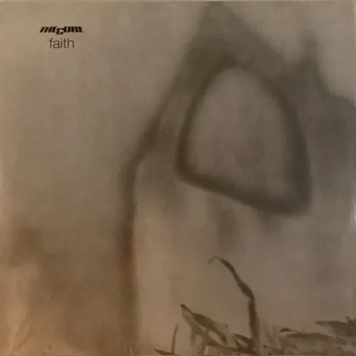A heavily blurred, sepia-toned photograph of a distant ruined stone archway or abbey window rising above faint grasses in the lower right, rendered in hazy grey-brown monochrome.