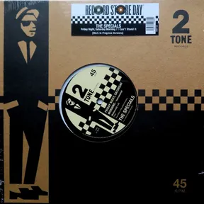A brown cardboard-style sleeve with a black cut-out illustration of a suited rude boy in sunglasses and porkpie hat down the left side, black-and-white checkerboard banding, and a shrink-wrapped die-cut window revealing the cream and black record label at center.