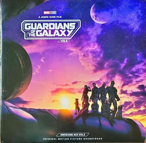 A group of silhouetted figures, including a raccoon and a tree-like creature, stand atop a curved rocky ledge against a vivid purple, pink and orange cloud-filled sky with a large planet and starfield above.